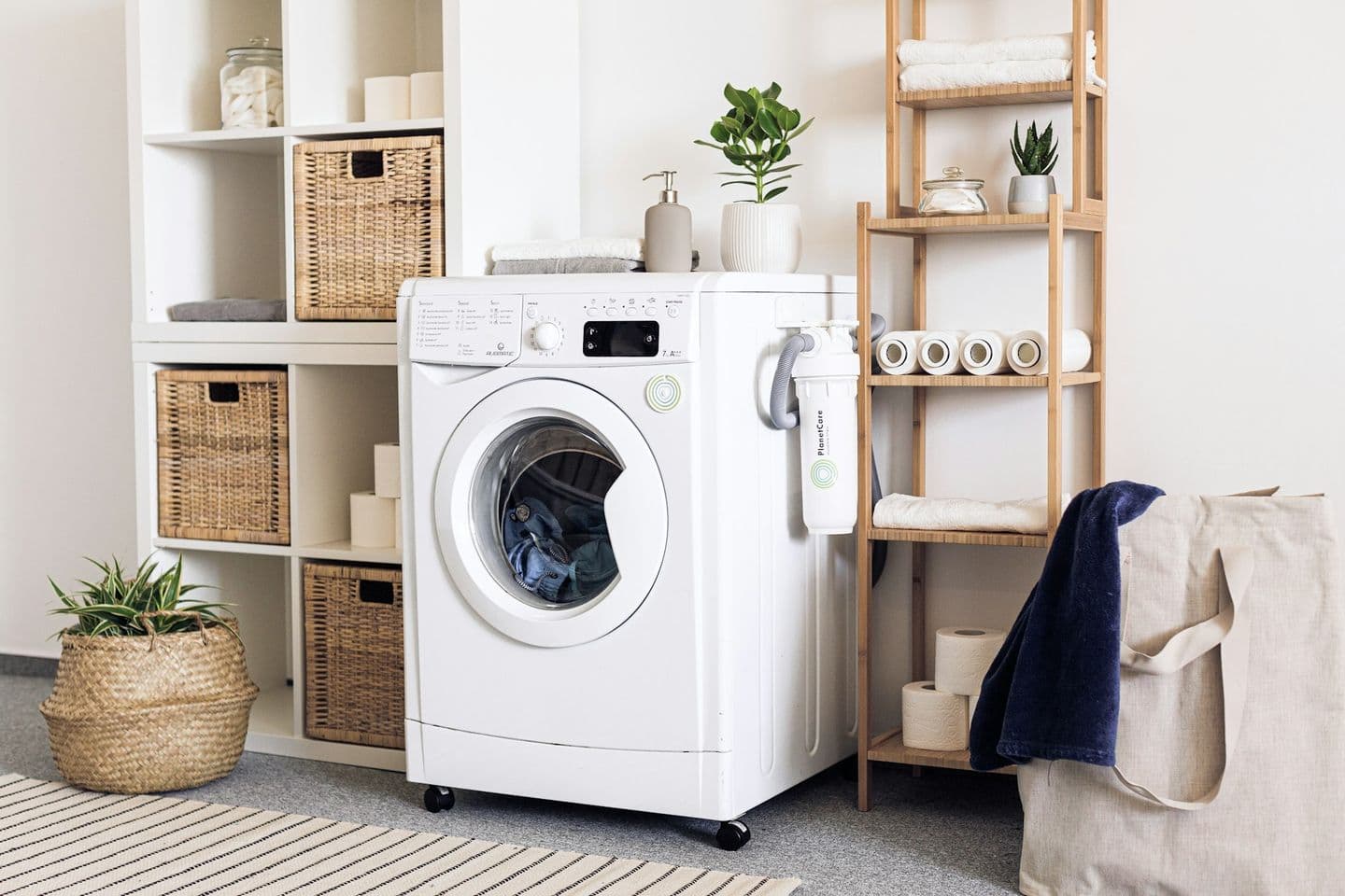 Calm laundry with washing machine and woven baskets