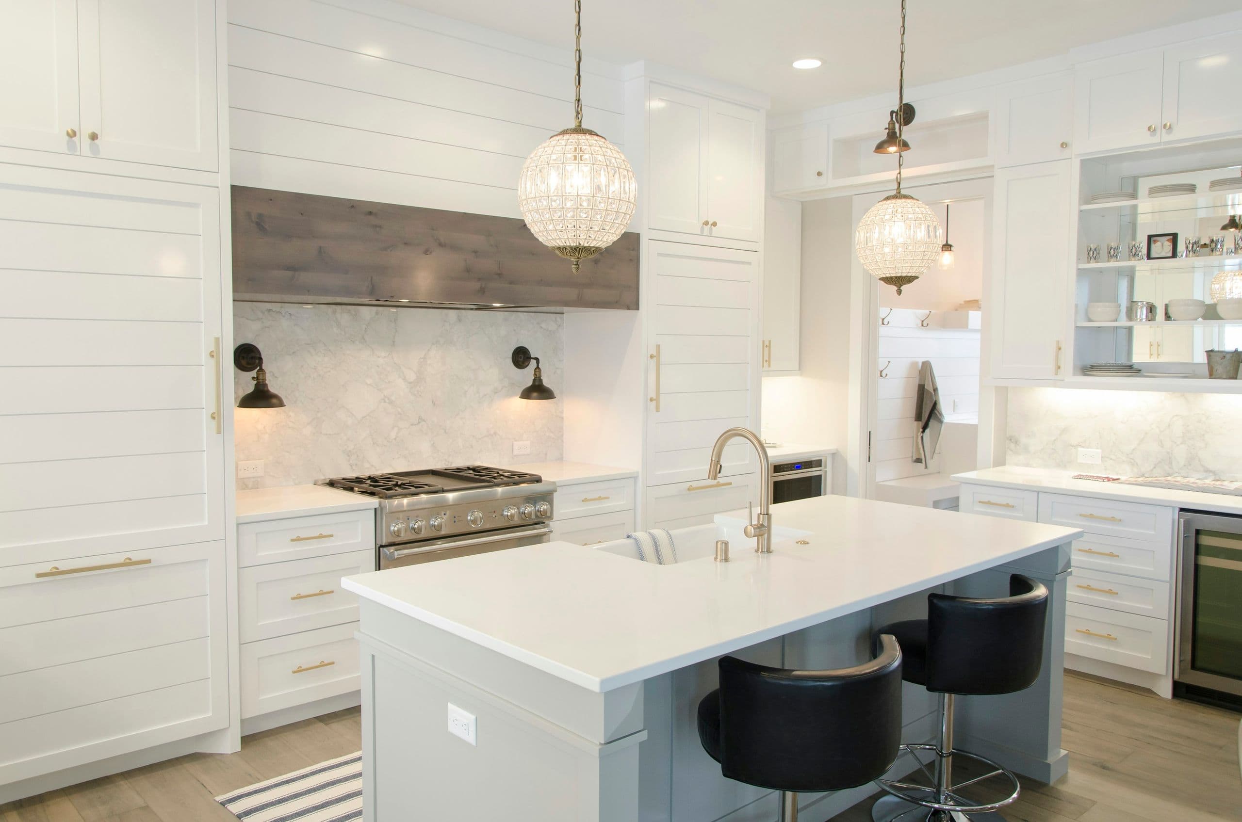 White marble island kitchen with pendant lighting
