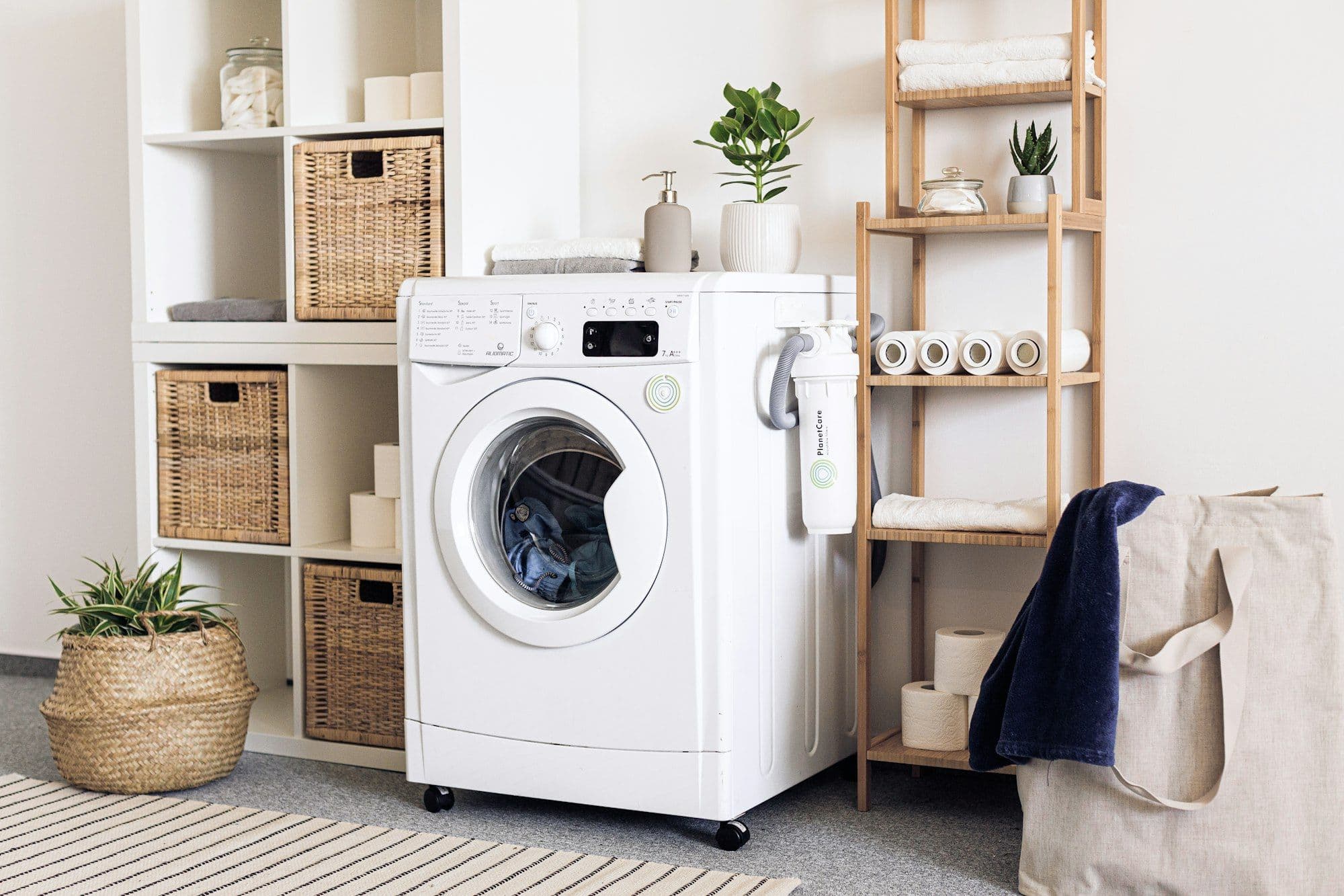 Calm laundry with washing machine and woven baskets