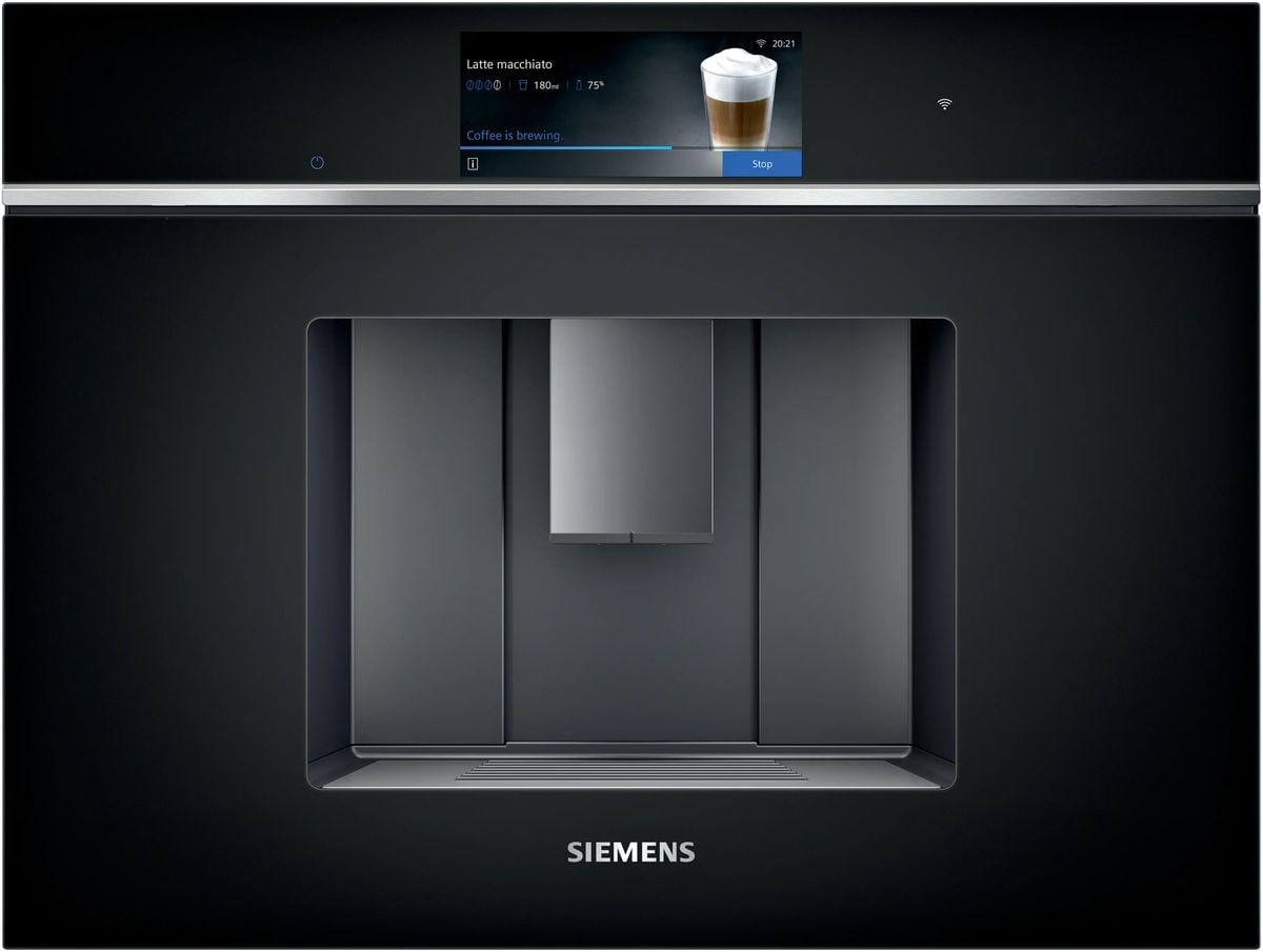Siemens studioLine iQ700 built-in coffee machine in black glass, brewing a latte macchiato