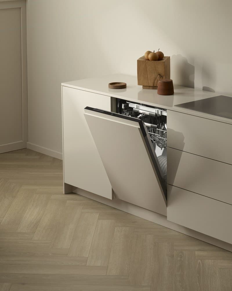 V-ZUG dishwasher open in a minimalist kitchen